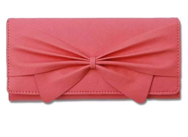 Women's stylish ribbon long wallet in pink synthetic leather with a bold bow design.