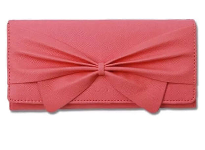 Women's stylish ribbon long wallet in pink synthetic leather with a bold bow design.